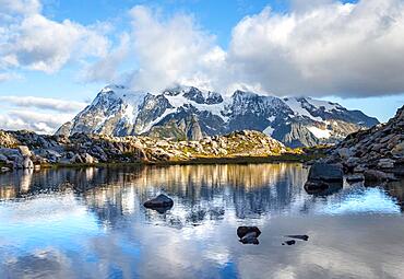 Reflection in the lake at Huntoon Point, view of cloudy Mt. Shuksan with glacier and snow, Mt. Baker-Snoqualmie National Forest, Washington, USA, North America