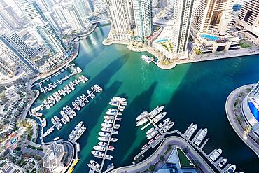 Dubai Marina and Harbour luxury wealth holiday with boats yacht from above in Dubai, United Arab Emirates, Asia