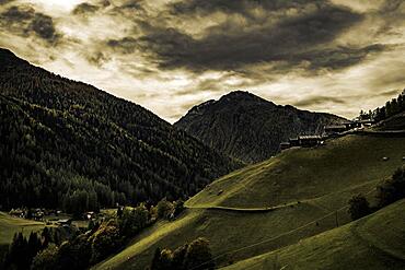 Old farms on a mountain meadow with mountains in the background, Ulten Valley, Merano, South Tyrol, Italy, Europe