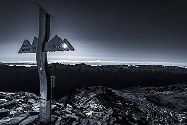 Backlit summit cross of the Lyfispitze, Martell Valley, Naturno, South Tyrol, Italy, Europe