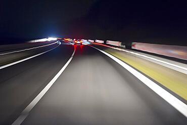 View from a Moving Car at Night on the Curvy Road, Germany, Europe