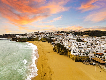 Aerial view of whitewashed architecture of Albufeira by the Atlantic Ocean at sunset, townscape, Algarve, Portugal, Europe