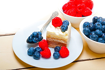 Fresh homemade raspberry and blueberry cream cake