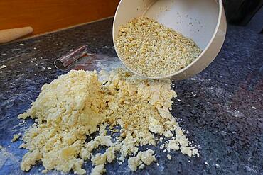 Southern German cuisine, baking, preparing the walnut dough for the hearty vegetable cake with walnut base, Germany, Europe