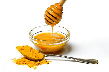 Bee honey with turmeric and turmeric powder, ingredient for Golden Milk, healthy milk drink