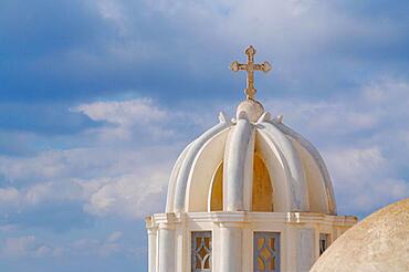 Close-up of dome and cross from santorini, Greece on a summer day