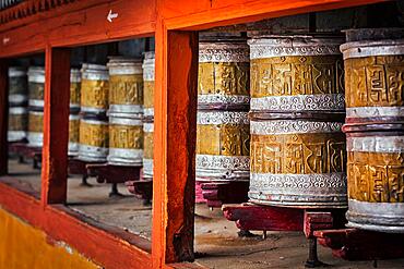 Buddhist prayer wheels in Hemis gompa (Tibetan buddhist monstery) . Ladakh, India, Asia