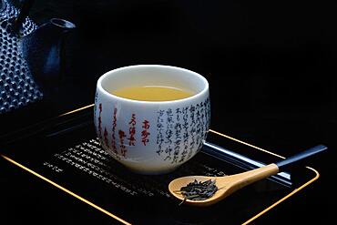 Green tea (Sencha) in spoon and tea bowl, Japan, green tea, Asia