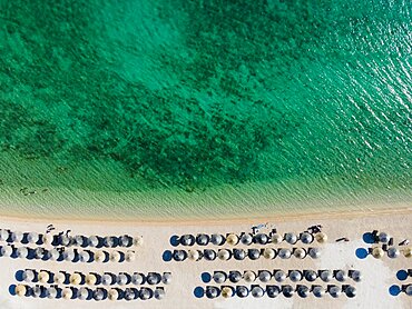 Drone shot, sunshades at White Beach, Sibenik, Sibenik-Knin, Dalmatia, Croatia, Europe