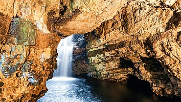 Grotto and Waterfall in Smoo Cave, NC500, North Scotland, UK