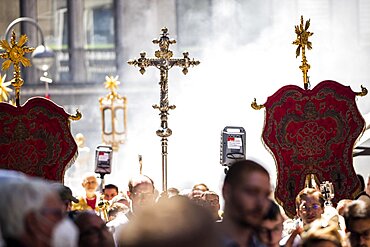 People walk through the streets of the city in incense mist during the Corpus Christi procession, Cologne, North Rhine-Westphalia, Germany, Europe