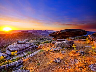 Sombrerillo limestone rock formations at sunrise, El Torcal nature reserve, Torcal de Antequera, Malaga province, Andalusia, Spain, Europe