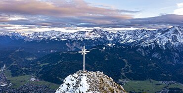 Alpine panorama with Zugspitze and summit cross of the Kramer, aerial view, mountains with snow in the evening, summit of the Kramer, Garmisch, Bavaria, Germany, Europe