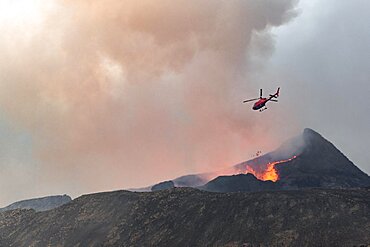 Helicopter flying over smoking active volcanic crater, glowing lava, volcanic eruption, active table volcano Fagradalsfjall, Krysuvik volcanic system, Reykjanes Peninsula, Iceland, Europe