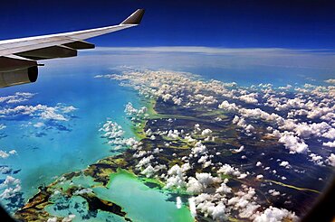 Clouds, sea from above and wing, Cuba, Caribbean island, Central America