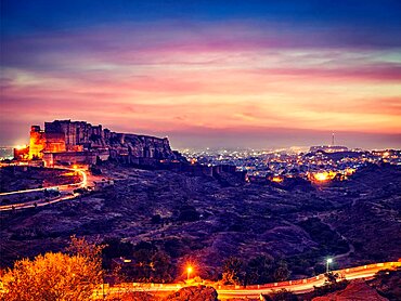 Vintage retro effect filtered hipster style image of famous indian tourist landmark Mehrangarh fort in twilight. Jodhpur, Rajasthan, India, Asia