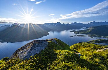 Sun shining on Fjord Raftsund and mountains, view from the top of Dronningsvarden or Stortinden, Vesteralen, Norway, Europe