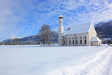 The baroque Coloman Church, St. Coloman, in winter in a landscape covered in deep snow, near Schwangau, Oestallgaeu, Swabia, Bavaria, Germany, Europe