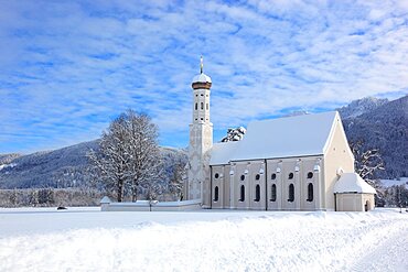 The baroque Coloman Church, St. Coloman, in winter in a landscape covered in deep snow, near Schwangau, Oestallgaeu, Swabia, Bavaria, Germany, Europe