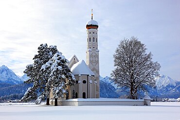 The baroque Coloman Church, St. Coloman, in winter in a landscape covered in deep snow, near Schwangau, Oestallgaeu, Swabia, Bavaria, Germany, Europe