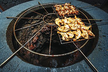 Tasty meat barbecued on volcanic heat, Timanfaya National Park, Canary Islands, Spain, Europe