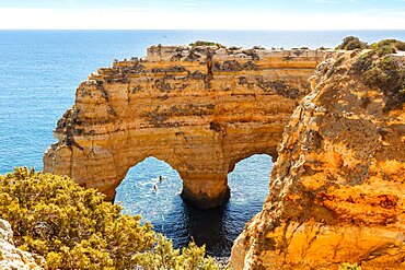 Algarve beach Praia da Marinha by the sea Rock formation in the shape of a heart Ocean in Praia da Marinha, Portugal, Europe