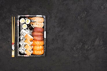 Set healthy asian rolls arranged tray sticks black background. Resolution and high quality beautiful photo