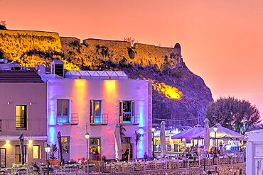 Venetian harbour, dusk, night shots, orange sky, artificial light, colourful rows of houses, Rethimnon, central Crete, island of Crete, Greece, Europe