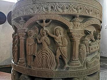 Baptism relief, John raising his right hand over Jesus standing in the Jordan, Romanesque baptismal font from 1129 in the former collegiate church of St Boniface, Freckenhorst, Warendorf district, Baden-Wuerttemberg, Germany, Europe