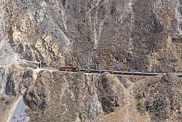 Railway in the Rimac Valley, zigzag track on the mountainside, San Mateo, Peru, South America