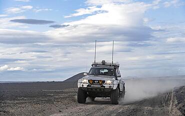 Four-wheel drive vehicle on a track, volcanic landscape, barren landscape, Vatnajoekull National Park, Icelandic Highlands, Iceland, Europe