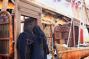 Old Town of Doha, veiled woman shopping, Qatar, Qatar, Asia