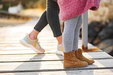 daughter mother feet shoes. High resolution photo