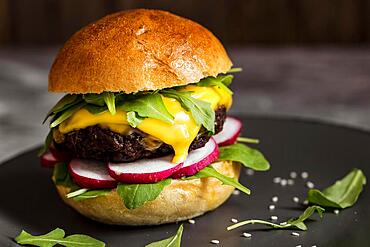 close up cheeseburger board