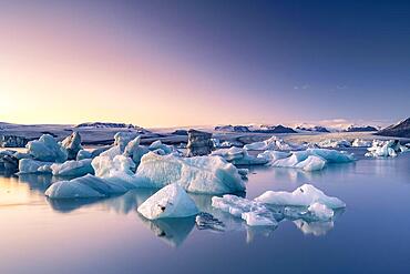 Joekulsarlon glacier lagoon in the evening mood, icebergs with glacier, Vatnajoekull National Park, Hornafjoerour, South Iceland, Iceland, Europe