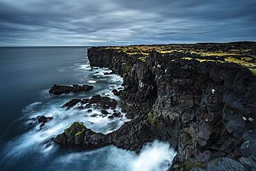 Cliff with rock formations near Oendverdarnes, long exposure, Oendveroarnes, Snaefellsjoekull National Park, Snaefellsnes Peninsula, Snaefellsnes, Vesturland, Iceland, Europe