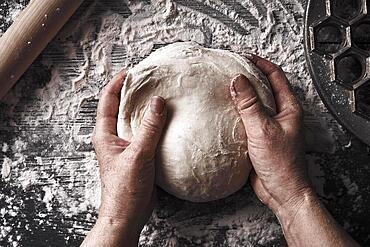 Cooking dough by elderly woman cook hands for homemade pastry bread, pizza, pasta recipe preparation on table background