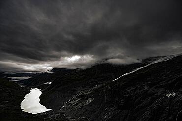 Mountain lake Lej da Vadrett with Val Rosegg and dramatic clouds, St Moritz, Engadin, Grisons, Switzerland, Europe