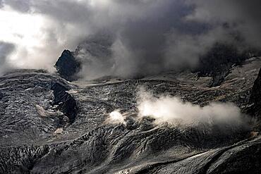 Bernina Group with Rosegg Glacier and dramatic clouds at blue hour, St Moritz, Engadin, Grisons, Switzerland, Europe