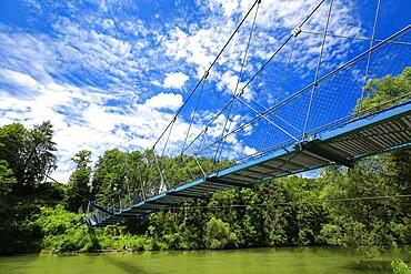 Steel suspension bridge over the Iller in fine weather. Bad Groenenbach, Unterallgaeu, Swabia, Bavaria, Germany, Europe