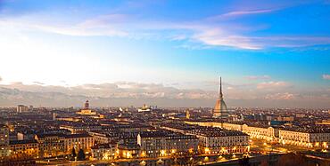 Turin, Piedmont Region, Italy. Panorama from Monte dei Cappuccini (Cappuccinis Hill) at sunset with Alps mountains and Mole Antonelliana monument