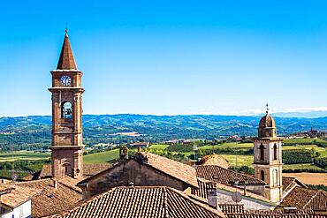 GOVONE, ITALY - CIRCA AUGUST 2020: Piedmont hills in Italy, Monferrato area. Scenic countryside during summer season with vineyard field. Wonderful blue sky in background