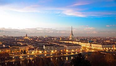 Turin, Piedmont Region, Italy. Panorama from Monte dei Cappuccini (Cappuccinis Hill) at sunset with Alps mountains and Mole Antonelliana monument