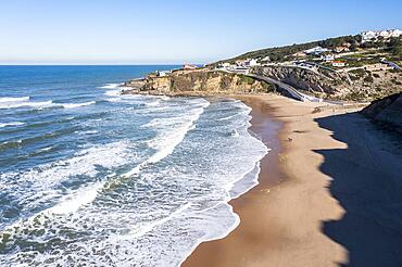 Aerial view, surf and waves at Praia do Magoito beach, Magoito, Portugal, Europe