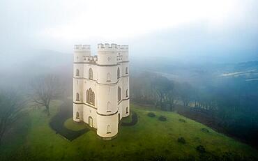 Misty morning over Haldon Belvedere from a drone, Lawrence Castle, Higher Ashton, Exeter, Devon, England, United Kingdom, Europe