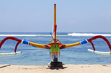 Brightly painted fishing outriggers on the beach at Sanur, Bali, IndonesiaIndonesia, Bali, Sanur, fishing outriggers on the beach of Sanur