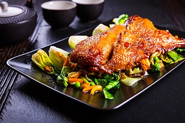 Delicious Peking duck breast with pak choi and vegetables