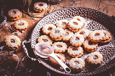 Homemade Christmas cookies with candles in white vintage style