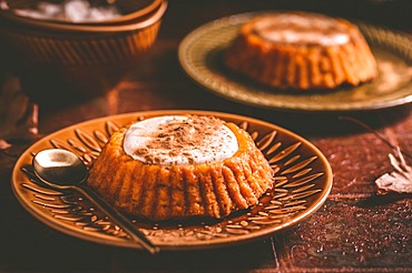 Homemade small pumpkin pies with icing for Thanksgiving