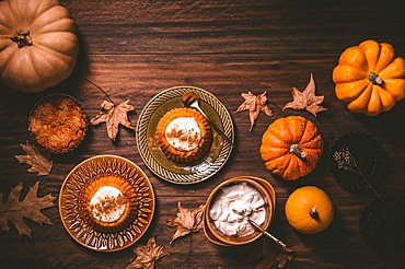 Homemade small pumpkin pies with icing for Thanksgiving